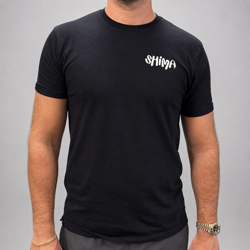 Male model wearing SHIMA black t-shirt front view
